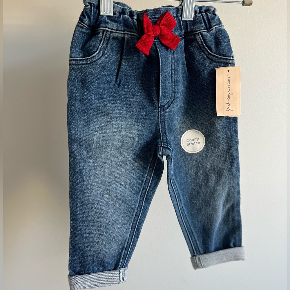 First impressions baby girl jeans for 12 m girl. With red bow.